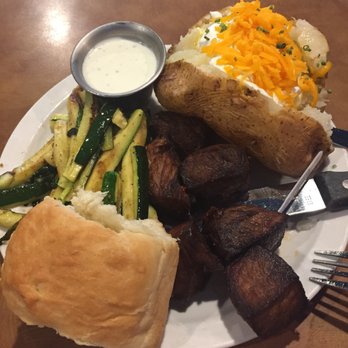 Maxey's Steakhouse - Maxey's Special.  Select choice sirloin cut and marinated in a fabulous curry sauce and then deep fried with a loaded potato and zucchini. - Steakhouses Near Me - Wheeler, Texas