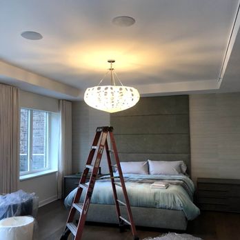 New World Contracting - a bedroom with a ladder in the foreground - Flooring Near Me New World Contracting - a bedroom with a ladder in the foreground - Flooring Near Me