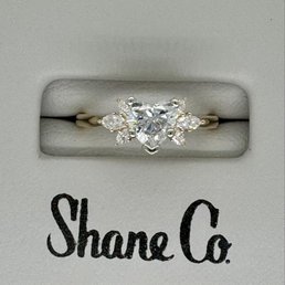 Heart shaped diamond with marquise side stone setting. Heart shaped diamond with marquise side stone setting.