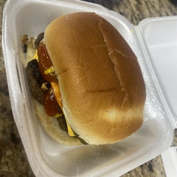 Caribbean Island Spice Grill - a hamburger in a styrofoam container - Caribbean Near Me - Houston, Texas Caribbean Island Spice Grill - a hamburger in a styrofoam container - Caribbean Near Me - Houston, Texas