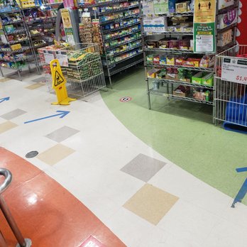 H Mart - Diamond Bar - How are customers supposed to see this tape on the ground when it's busy? Avoid confusion by having a normal line system... - Grocery Near Me - Diamond Bar, California