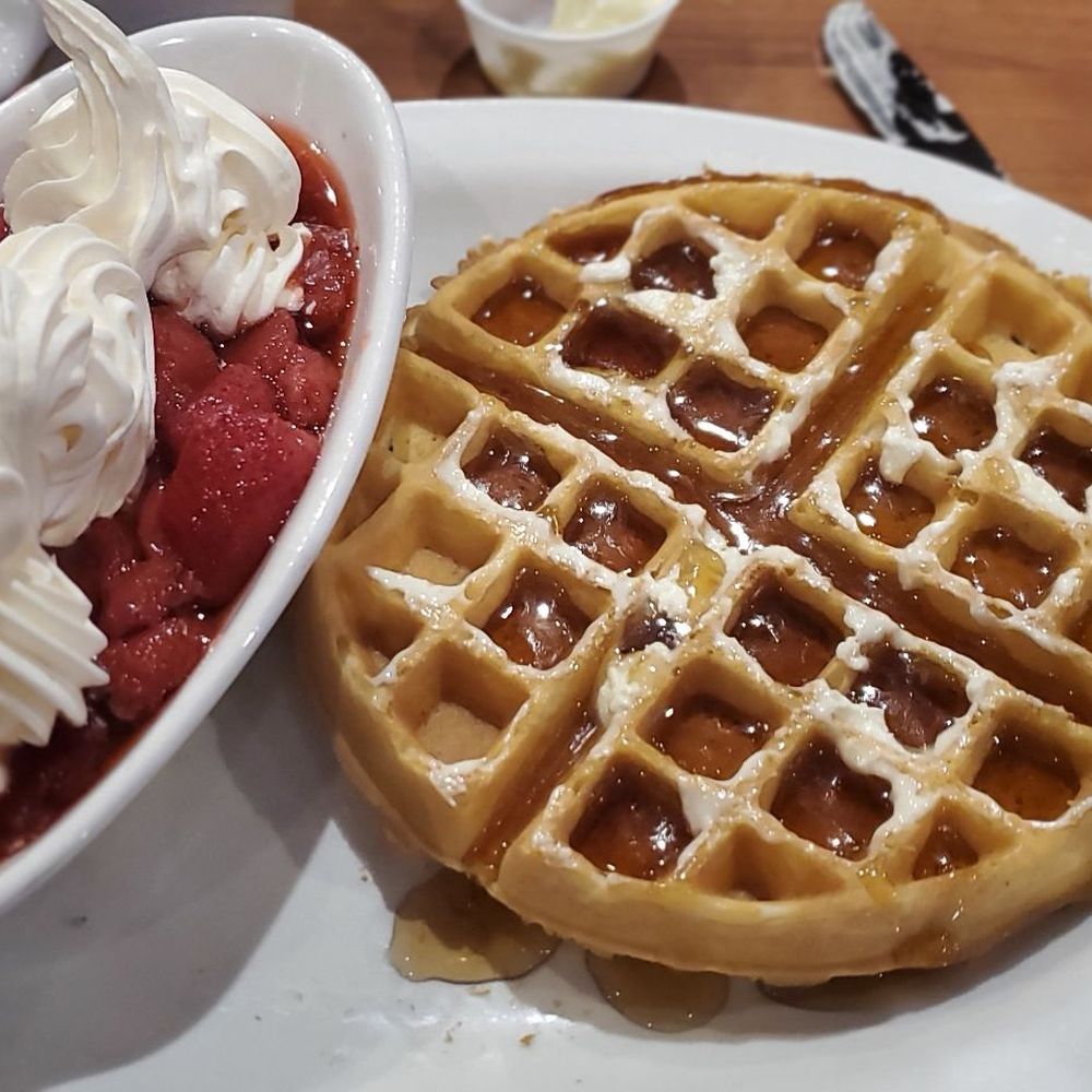 Moonshiners - Waffle with strawberries and im pretty sure rich and creamy ready whip - American Near Me - Pahrump, Nevada Moonshiners - Waffle with strawberries and im pretty sure rich and creamy ready whip - American Near Me - Pahrump, Nevada