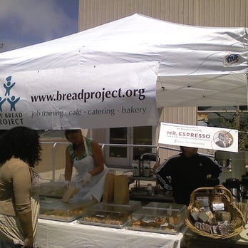 Beehive Market - a woman standing under a white tent - Farmers Market Near Me - Berkeley, California Beehive Market - a woman standing under a white tent - Farmers Market Near Me - Berkeley, California