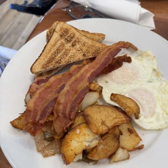 Peach Valley Cafè - Two eggs over easy home, fries with peppers and onions and mushrooms, toast, and thick cut, apple flavored bacon. - Breakfast & Brunch Near Me - Orlando, Florida Peach Valley Cafè - Two eggs over easy home, fries with peppers and onions and mushrooms, toast, and thick cut, apple flavored bacon. - Breakfast & Brunch Near Me - Orlando, Florida