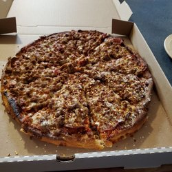 Milanos Pizza - Large Meat Muncher in a 16" box and beyond burnt.  Toppings were only 4 or 5 pieces of pepperoni ringing the top and sausage.