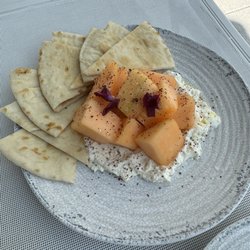 Whipped feta with melon and sourdough naan