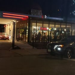 Fat Burger - It is open and crowded. Drive-thru open. Old bank setup. Long lines