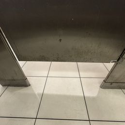 Caked on grime inside stall