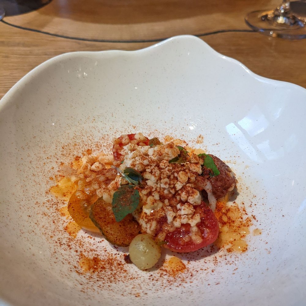 Tomato salad with cucumber foam and gooseberries