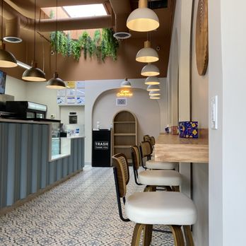 Olba - Countertop with comfortable stools - Mediterranean Near Me - Brookline, Massachusetts Olba - Countertop with comfortable stools - Mediterranean Near Me - Brookline, Massachusetts