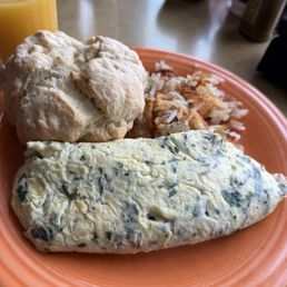 Herb goat cheese omelette, side biscuit and hash browns