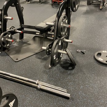 EōS Fitness - Mismatched weights, bars and pad left on the floor. - Gyms Near Me - Casselberry, Florida EōS Fitness - Mismatched weights, bars and pad left on the floor. - Gyms Near Me - Casselberry, Florida