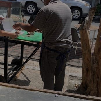 El Sabroso Lechon - Owner Tony cutting up some deliciousness - Puerto Rican Near Me - San Juan, Puerto Rico El Sabroso Lechon - Owner Tony cutting up some deliciousness - Puerto Rican Near Me - San Juan, Puerto Rico