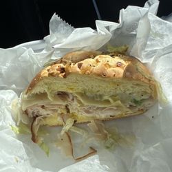 Frisco Deli - Half of my amazing turkey and provolone on an onion roll. Mayo. Mustard and lettuce. Hot.