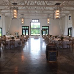 Ashton Hill Farm - Main event space. Beautiful wooden chairs and windows to fields of sunflowers outside.