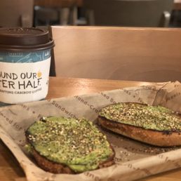 Avocado toast on a garlic bagel with a cinnamon spice tea. Delicious Avocado toast on a garlic bagel with a cinnamon spice tea. Delicious