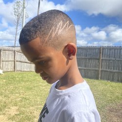Straight Edge Barber Lounge - J.B does and amazing job on my sons hair... super easy to schedule appointments online and the shop is super nice!! Love this place!