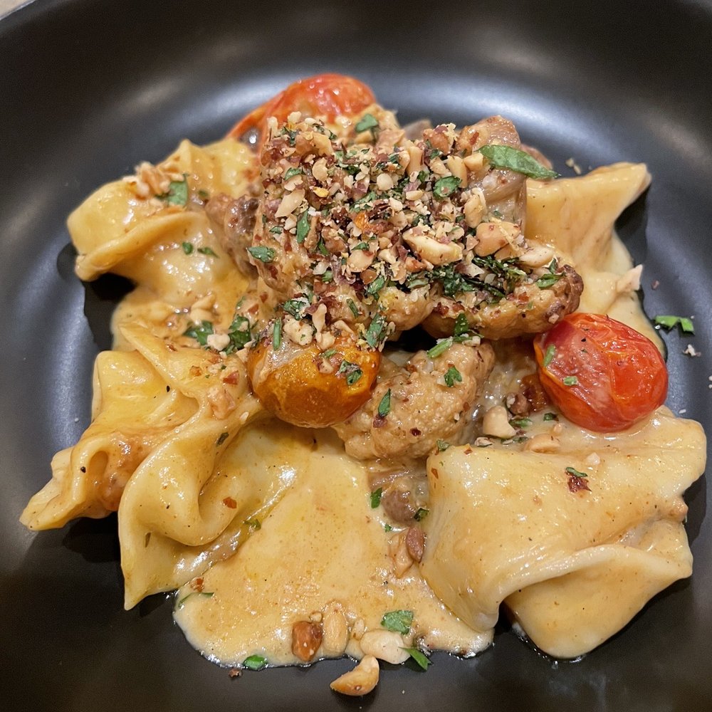 Epic Restaurant - a plate of pasta with meat and vegetables - New American Near Me - Columbus, Georgia Epic Restaurant - a plate of pasta with meat and vegetables - New American Near Me - Columbus, Georgia