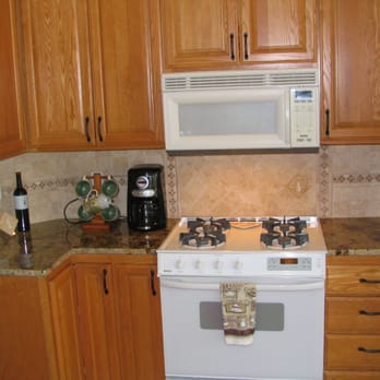 Royal Holland - a kitchen with a stove and microwave - General Contractors Near Me - Pasco, Washington Royal Holland - a kitchen with a stove and microwave - General Contractors Near Me - Pasco, Washington