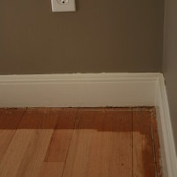 Hallmark - a wood floor in a room with a light switch - Carpeting Near Me - Wyckoff, New Jersey
