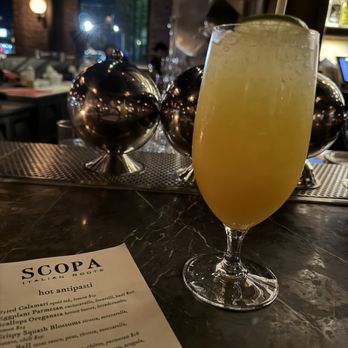 Scopa Italian Roots - Mocktail with soda water, lime juice, and passion fruit - Italian Near Me - Venice, California Scopa Italian Roots - Mocktail with soda water, lime juice, and passion fruit - Italian Near Me - Venice, California