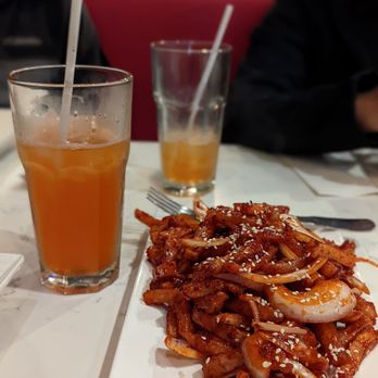 The Hakka Club - a plate of food and a glass of orange juice - Hakka Near Me - Mississauga, Ontario The Hakka Club - a plate of food and a glass of orange juice - Hakka Near Me - Mississauga, Ontario