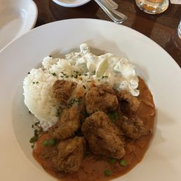 Rice with curry fried cauliflower with peas. Rice with curry fried cauliflower with peas.