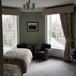 Stauntons On The Green - Small table and two arm chairs in room.
