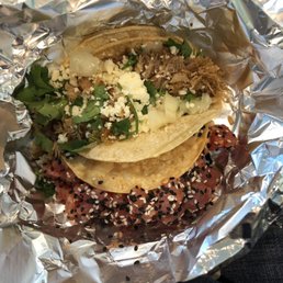 Top: carnitas taco. Bottom: ahi poke taco. Both were delicious. Ahi is extra charge but they packed it full of meat!