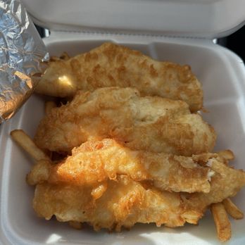 E Town Bar and Grille - Fish sandwich, fries underneath bun wrapped in foil on the left - American Near Me - Pittsburgh, Pennsylvania E Town Bar and Grille - Fish sandwich, fries underneath bun wrapped in foil on the left - American Near Me - Pittsburgh, Pennsylvania