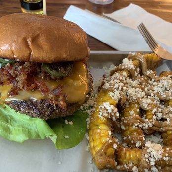 Bourbon On Main - Their Burger with bacon marmalade and jalapeños and street corn - Cocktail Bars Near Me - Frankfort, Kentucky