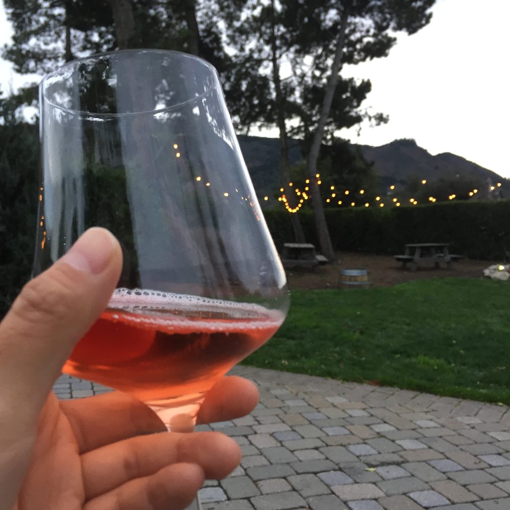 Folktale Winery - Glass of sparkling rose - Wineries Near Me - Carmel, California Folktale Winery - Glass of sparkling rose - Wineries Near Me - Carmel, California