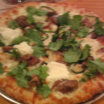 Pinthouse Pizza - The armadillo! Sausage, Poblano peppers, ricotta cheese and cilantro! - Pizza Near Me - Austin, Texas Pinthouse Pizza - The armadillo! Sausage, Poblano peppers, ricotta cheese and cilantro! - Pizza Near Me - Austin, Texas