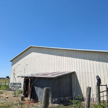 Texas Metal Master - An end view of the new roof on the front barn. - Roofing Near Me - Covington, Texas