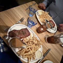Steak frites and chef's cut pork chop