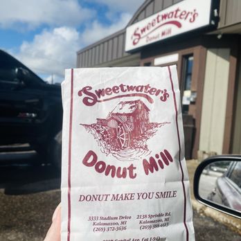 Sweetwater's Donut Mill - A takeout bag with the Sweetwater store front. - Donuts Near Me - Battle Creek, Michigan