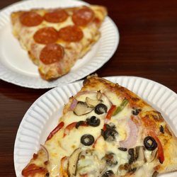 Wings Heaven & Pizza - We tried two slices while waiting for our to go order