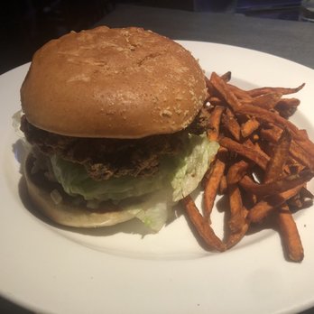 Yard House - Fried Chicken Sandwich with Sweet Potato Fries - New American Near Me - Indianapolis, Indiana Yard House - Fried Chicken Sandwich with Sweet Potato Fries - New American Near Me - Indianapolis, Indiana