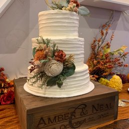 Lemon raspberry filled rustic style wedding cake- so good! We can't wait to have the top tier for our 1 year anniversary!!