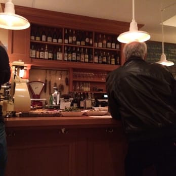 Etto - Guy having a drink right next to the side dishes, which sit out next to people at the bar all night. Awesome. - Bars Near Me - Washington, DC, District of Columbia