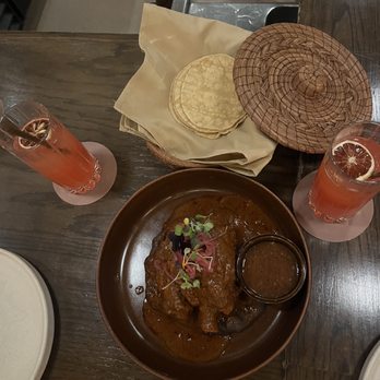 Tzuco - Signature drink for the month called the desert sip. Cochinita Pibil Entree with corn tortillas. - Mexican Near Me - Chicago, Illinois Tzuco - Signature drink for the month called the desert sip. Cochinita Pibil Entree with corn tortillas. - Mexican Near Me - Chicago, Illinois