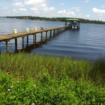 Piling Magic - a dock on a lake - General Contractors Near Me Piling Magic - a dock on a lake - General Contractors Near Me