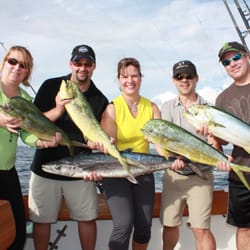 Productive Day - Happy Charter Guest from Canada with some nice Mahi-Mahi for dinner. Captain Justin Schumm