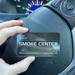 Smoke Center - This is a card with the Name and number of a employee with an address.