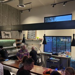 Boal City Brewing - Busy bar with 2 order lines inside and a window to the patio. Open a tab and enjoy!