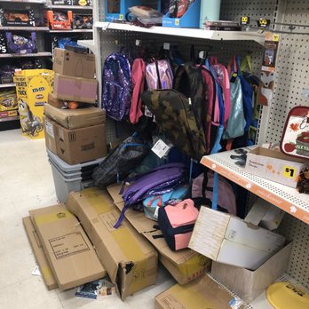 Dollar General - a dog in a store surrounded by boxes - Discount Store Near Me - Ringwood, New Jersey