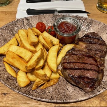 Maredo - Ribeye 300g cooked medium rare with fries for side And beer - Steakhouses Near Me - Berlin, BE Maredo - Ribeye 300g cooked medium rare with fries for side And beer - Steakhouses Near Me - Berlin, BE
