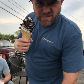 A&L Scoops and Swirls - a man holding an ice cream cone - Ice Cream & Frozen Yogurt Near Me - Middletown, Virginia A&L Scoops and Swirls - a man holding an ice cream cone - Ice Cream & Frozen Yogurt Near Me - Middletown, Virginia