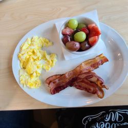 The Toasted Yolk Cafe - Bacon, eggs and fresh fruit