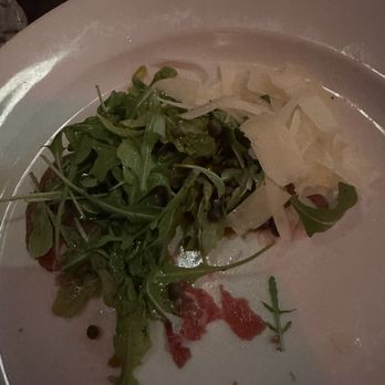 Chops Steakhouse - Carpaccio with a couple forks taken out - Steakhouses Near Me - Patchogue, New York